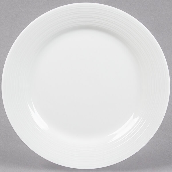 A Tuxton Pacifica bright white china plate with an embossed swirl design.