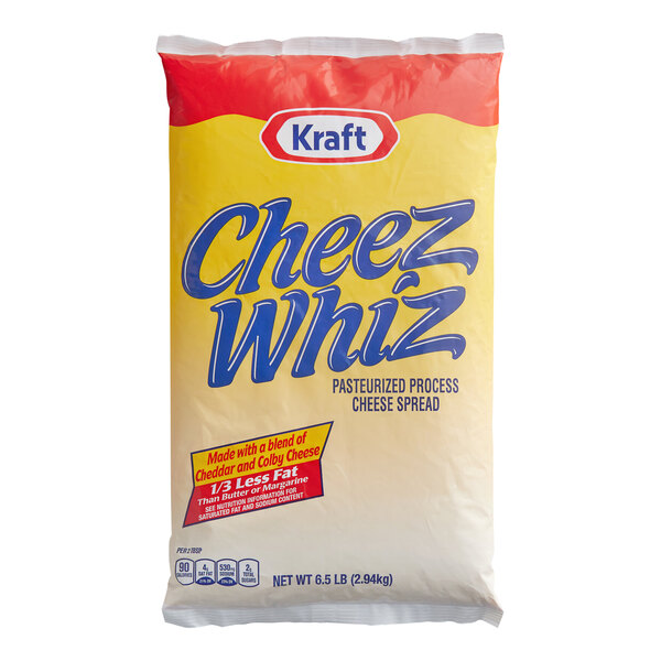 A large pouch of Kraft Cheez Whiz pasteurized process cheese spread with yellow and red packaging.