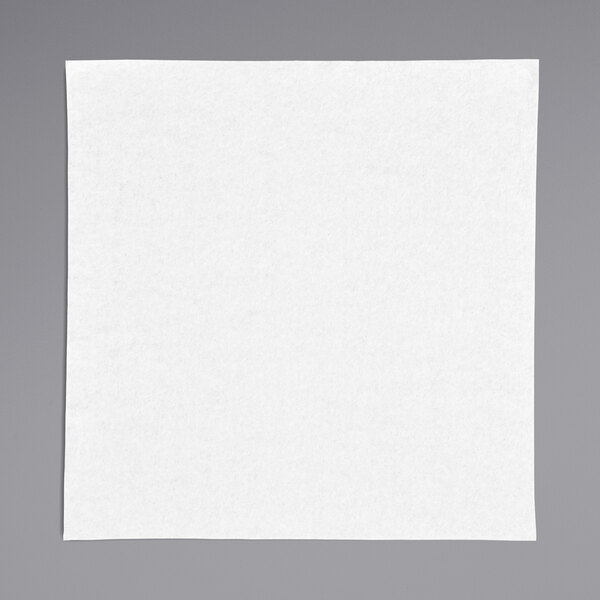 A white square linen-feel dinner napkin on a white surface.