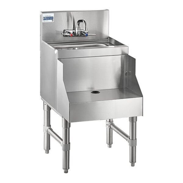 A stainless steel sink with a faucet in an Advance Tabco underbar blender station.