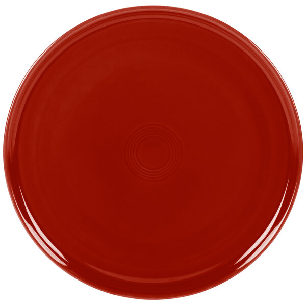 A red Fiesta china baking tray with a circle in the middle.