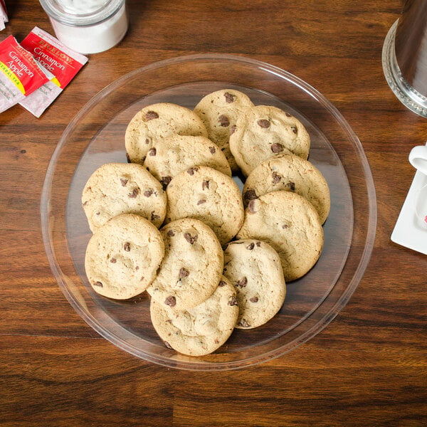 A Marco Company clear shallow tray holding cookies on a table.