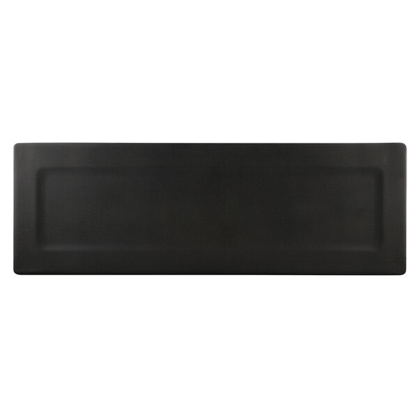 A black rectangular tray with a white border.