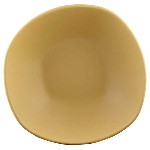 An Elite Global Solutions rattan-colored bowl on a white background.