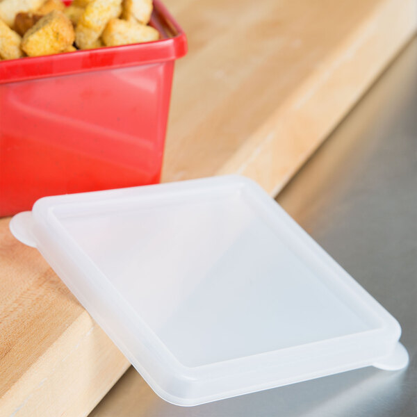 A clear plastic lid on a clear plastic crock.