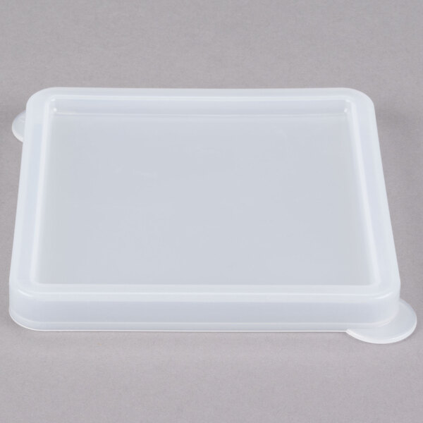 A clear square lid with a silver border on a white background.