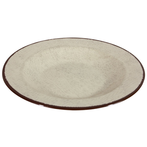 A white melamine pasta bowl with a brown rim.