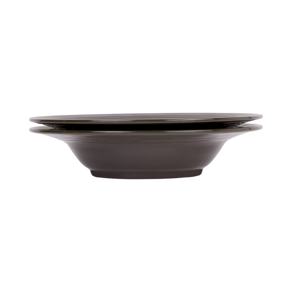 A close-up of a round black and blue two-tone melamine bowl.