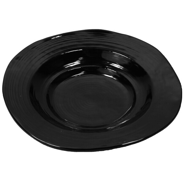 A black melamine bowl with a wavy edge.