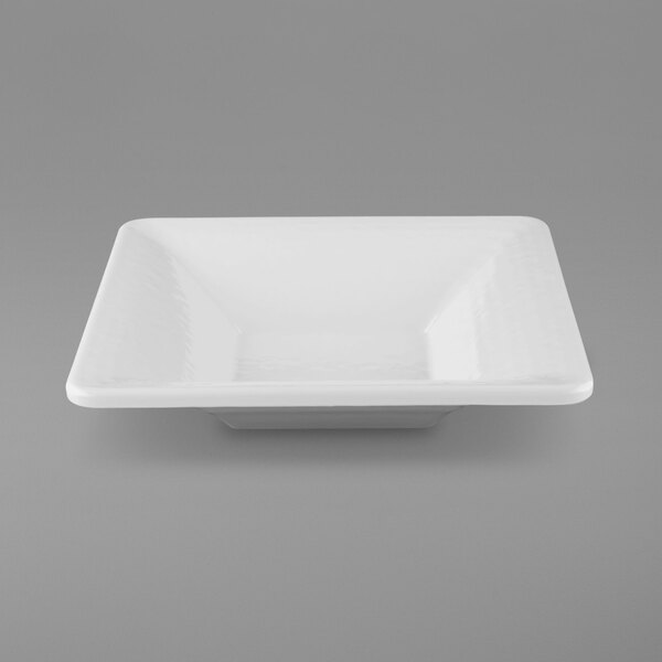 A white square melamine bowl with a pebble texture.