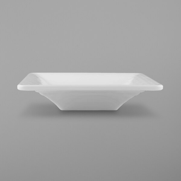 A white square bowl with a pebble texture on a white background.