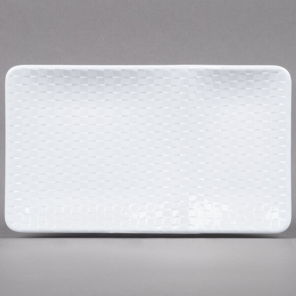 A white rectangular GET melamine platter with a pattern on it.