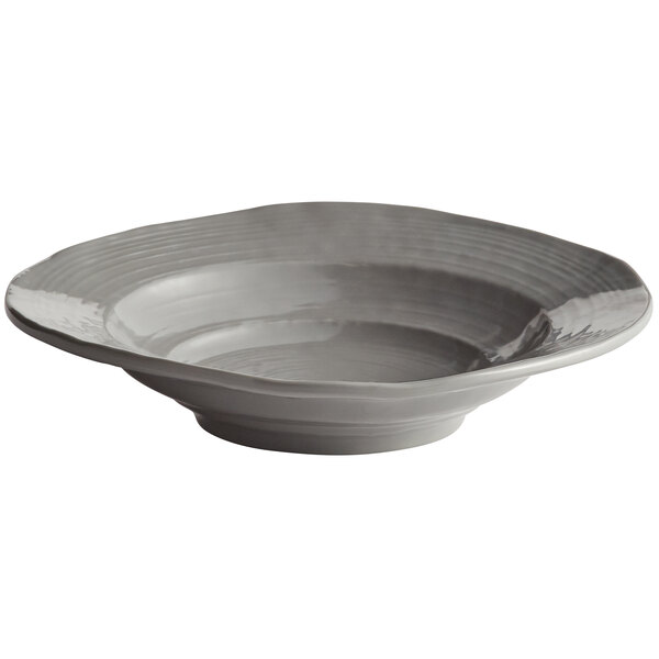 A bowl with a grey rim sits on a table.