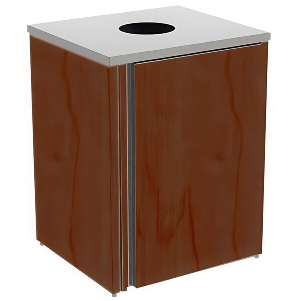 A rectangular wood refuse station with a metal top with a hole in it.