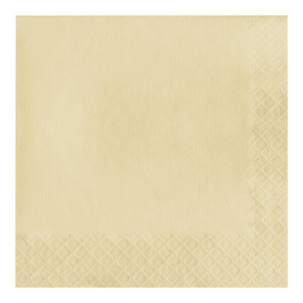 A close-up of an ivory paper napkin with a pattern.