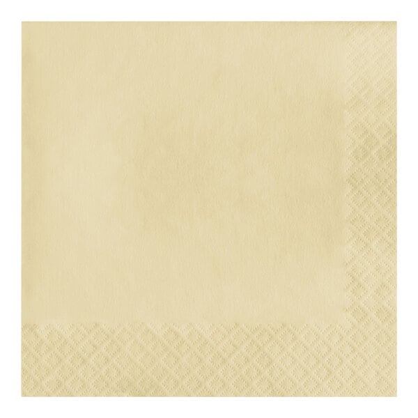 A close up of a Creative Converting ivory paper napkin with a 1/4 fold pattern.
