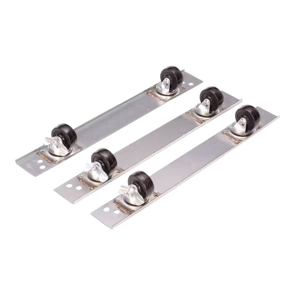 A group of metal parts with three black metal wheels.