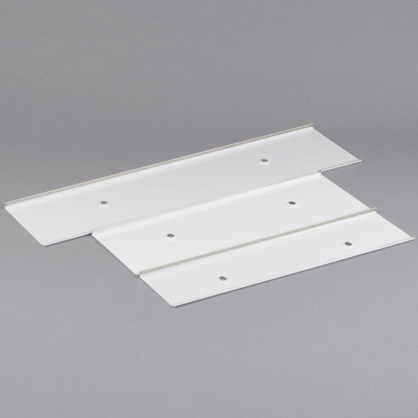 White plastic panels with holes used as a frost shield.