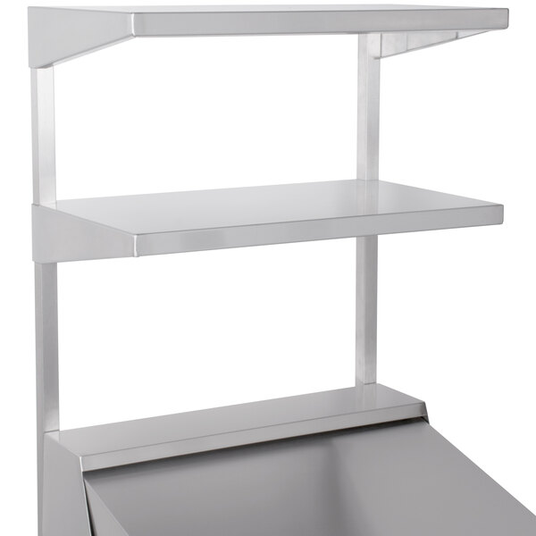 A silver metal Continental Refrigerator double overshelf on a white counter.