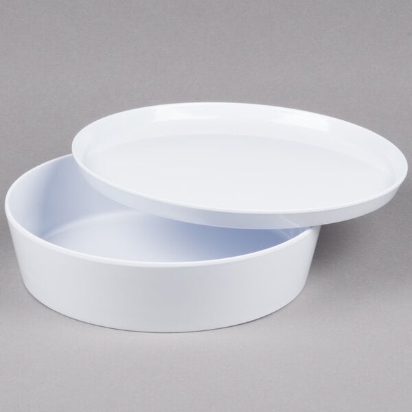 A white round melamine container with a lid.