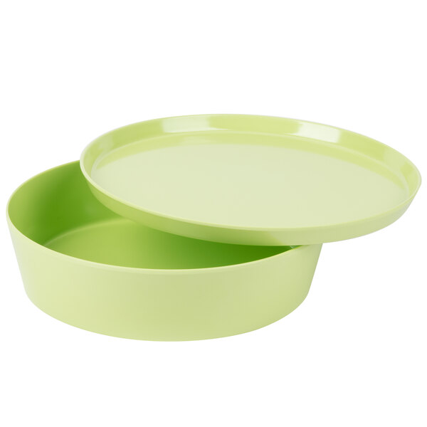 A lime green melamine round container with a lid.