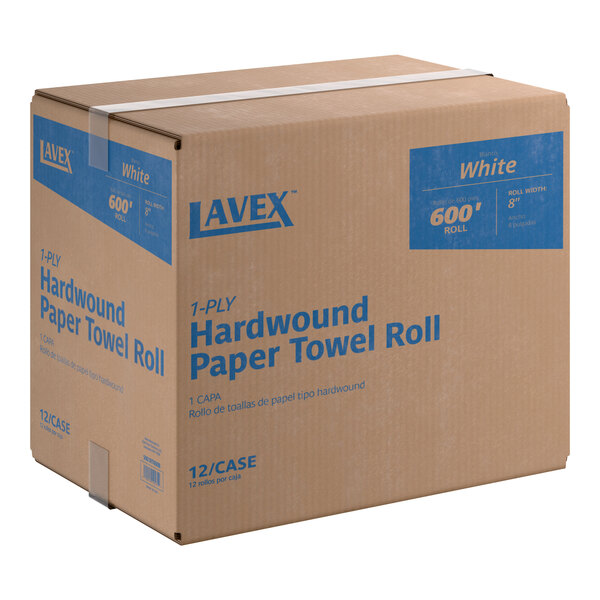 A cardboard box containing 12 rolls of Lavex white hardwound paper towels, each roll 600 feet long.