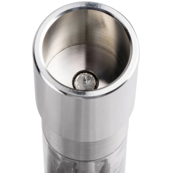 A close-up of an American Metalcraft stainless steel Presto push pepper/salt mill.