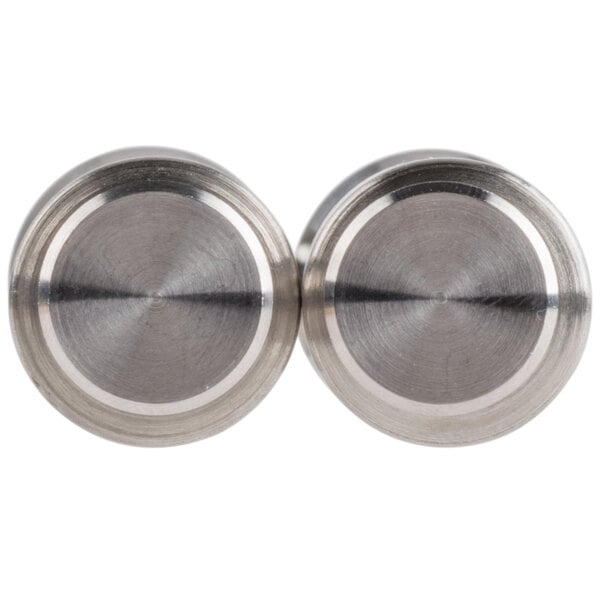 Two round stainless steel Presto Push salt and pepper mills.