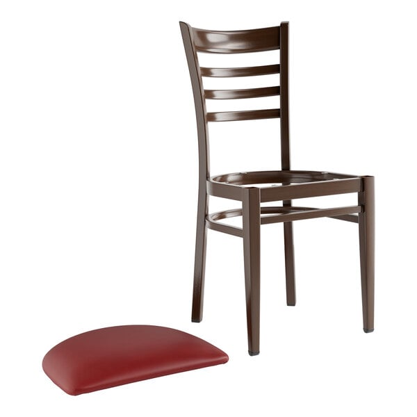 A Lancaster Table & Seating Spartan Series metal ladder back chair with dark walnut wood grain finish and burgundy vinyl seat.