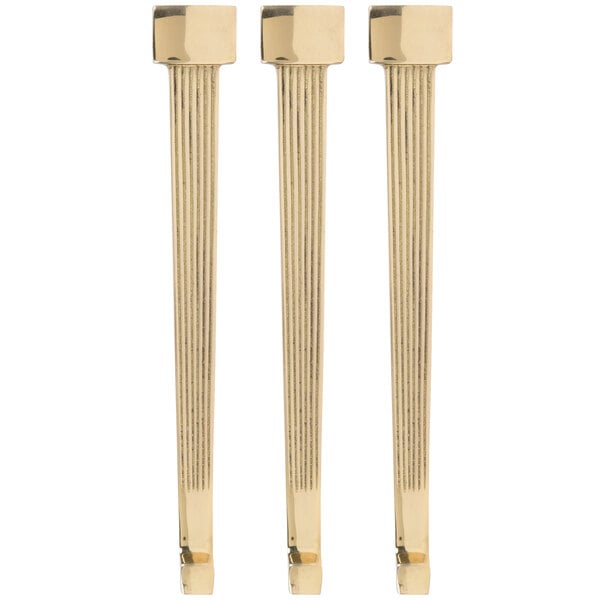 Three brass plated metal rods.