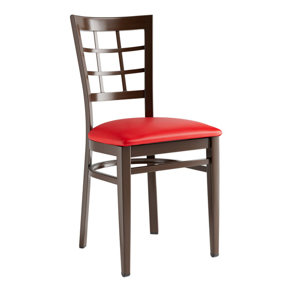A Lancaster Table & Seating Spartan Series chair with a red vinyl seat and dark walnut frame.