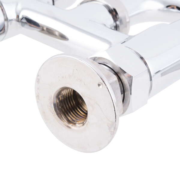 A close up of a chrome Equip by T&S deck-mount faucet with a swivel base.