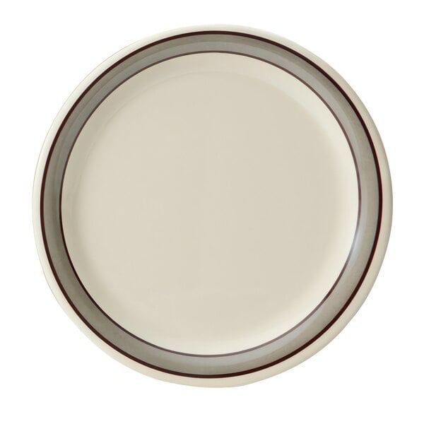 A white plate with a black border and brown stripes on it.