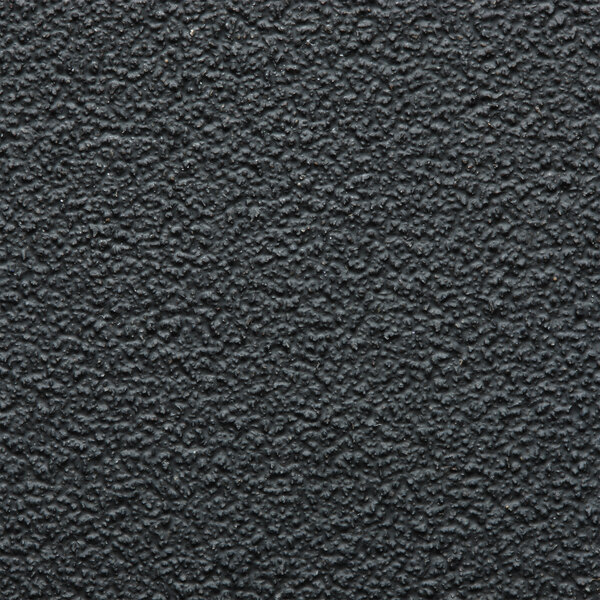 A close-up of a black surface with some scratches.