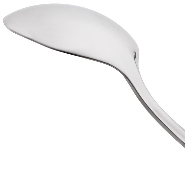 An Arcoroc stainless steel soup spoon with a silver handle.