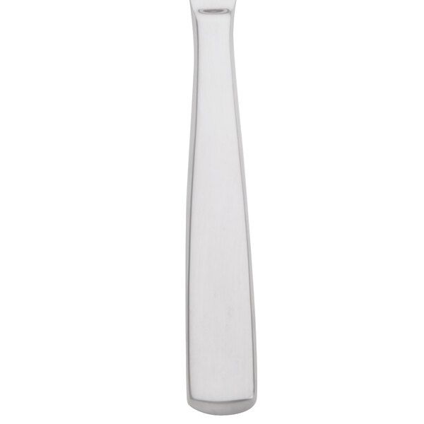 An Arcoroc stainless steel dinner knife with a white background.