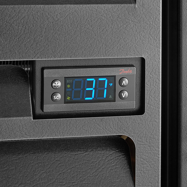 A digital display on a black Beverage-Air back bar refrigerator.