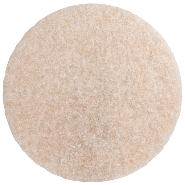 A round white and beige 3M burnishing pad.