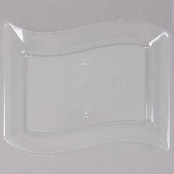 A clear plastic Fineline dessert plate with a curved edge.