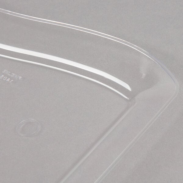 A clear Fineline plastic dessert plate on a white surface.