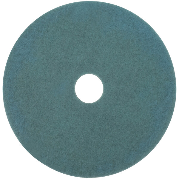 A blue circular 3M Aqua burnishing floor pad with a white circle and a black border in the middle.