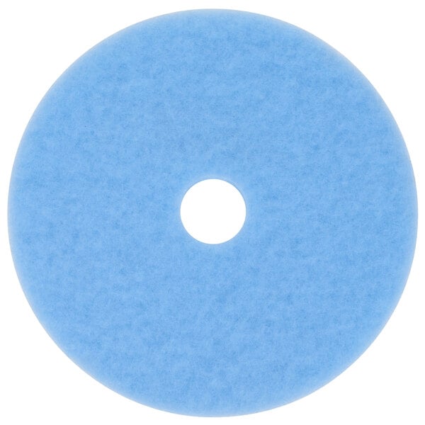 A sky blue circular 3M burnishing pad with a white center.