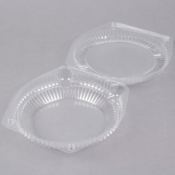 A clear plastic Polar Pak pie container with a low dome lid.