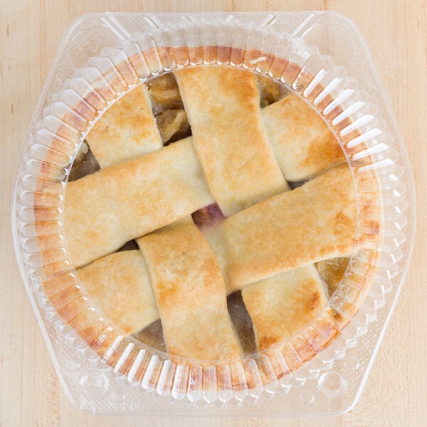 A pie in a Polar Pak plastic container with a clear low dome lid.