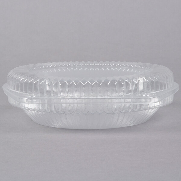 A clear plastic Polar Pak pie container with a low dome lid.