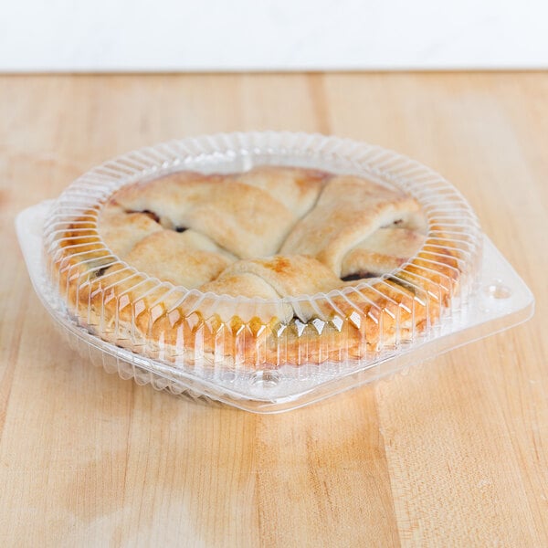 A pie in a Polar Pak plastic container with a low dome lid.