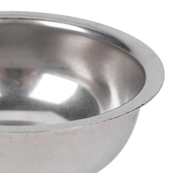 A stainless steel Vollrath butter melter cup with a handle.