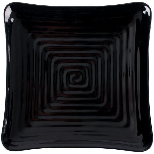 A black square GET Milano melamine plate with a spiral pattern.