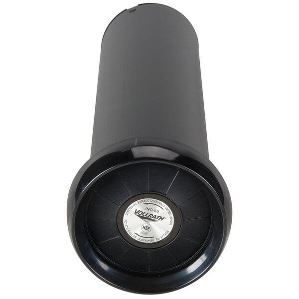 A black Vollrath in-counter cup dispenser with a white label.
