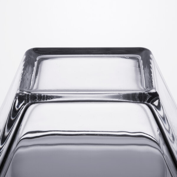 A close up of a Libbey square glass bowl.